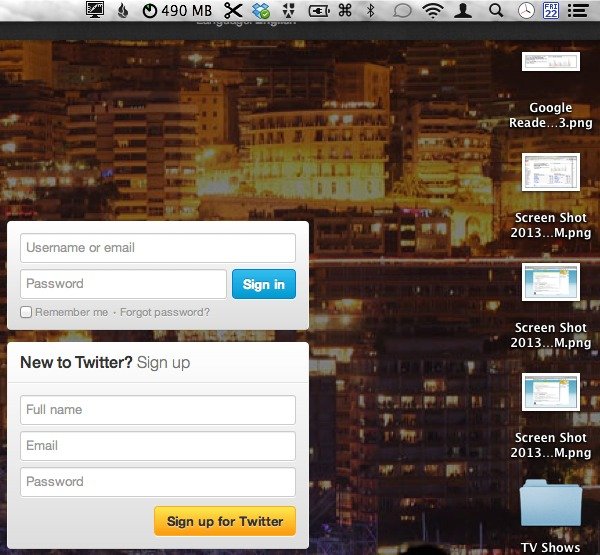 My desktop with Twitter.com as the wallpaper.