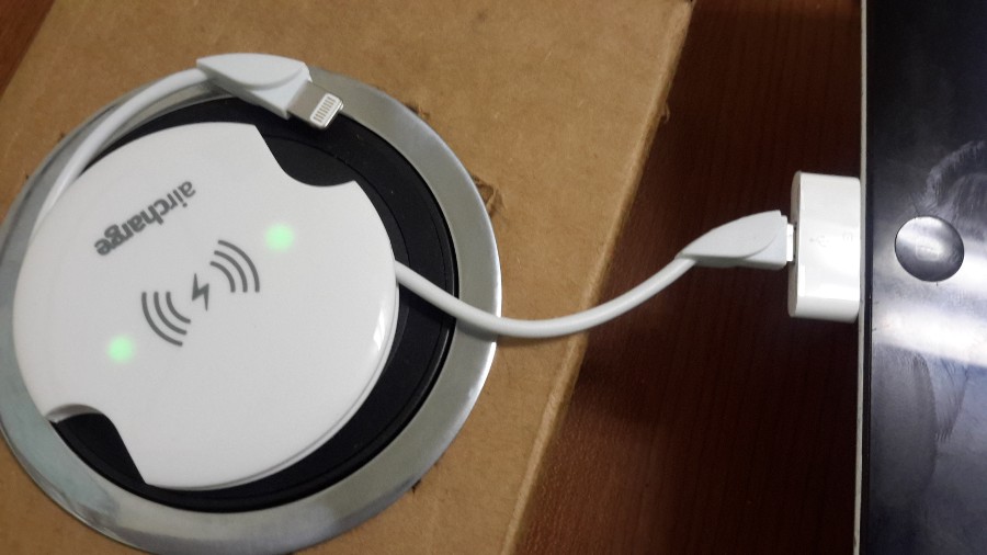 The Wireless Charging Receiver shows two green lights to let you know it's working properly.
