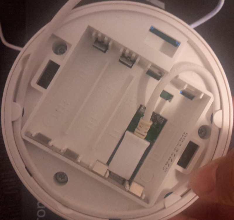 The micro-USB adapter plugged into the Bttn.