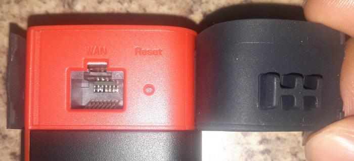 Hidden behind this flap is the ethernet port and reset button.