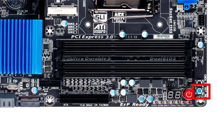 Motherboard showing the CMOS reset button.