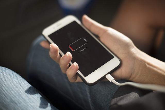 Charging your iPhone may resolve black screen issues.