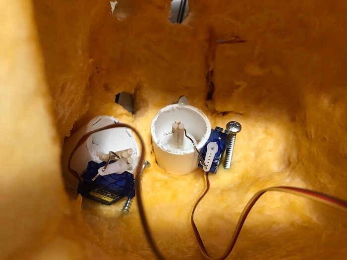 Place each servo inside your pumpkin. You may need to use lots of glue!