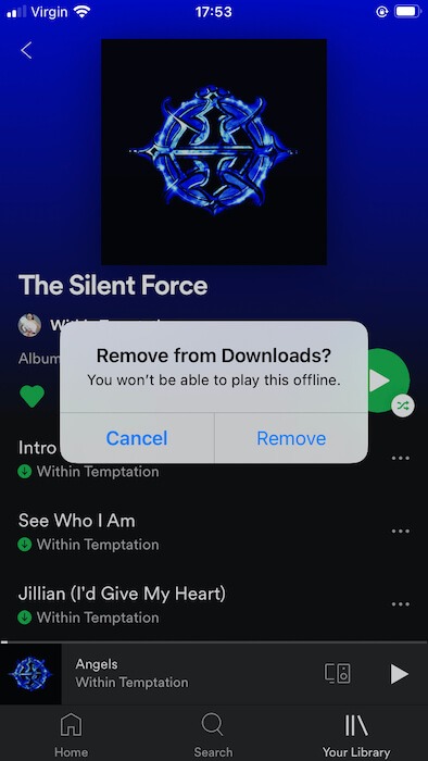 You can remove downloaded songs and playlists via the Spotify mobile app.