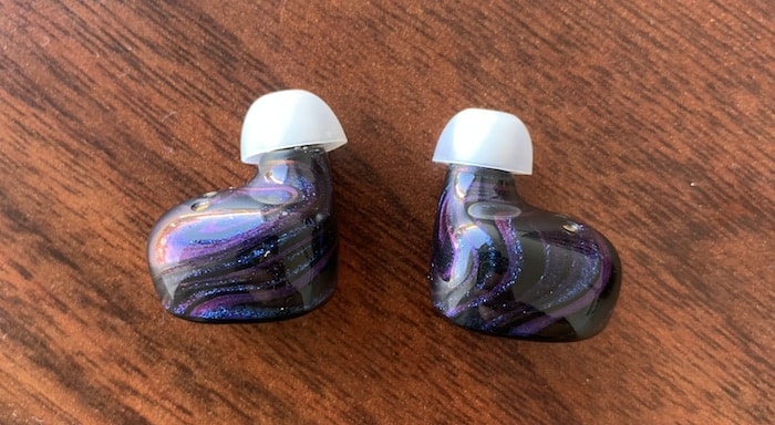 The shape of the Peacock Flight earbuds.