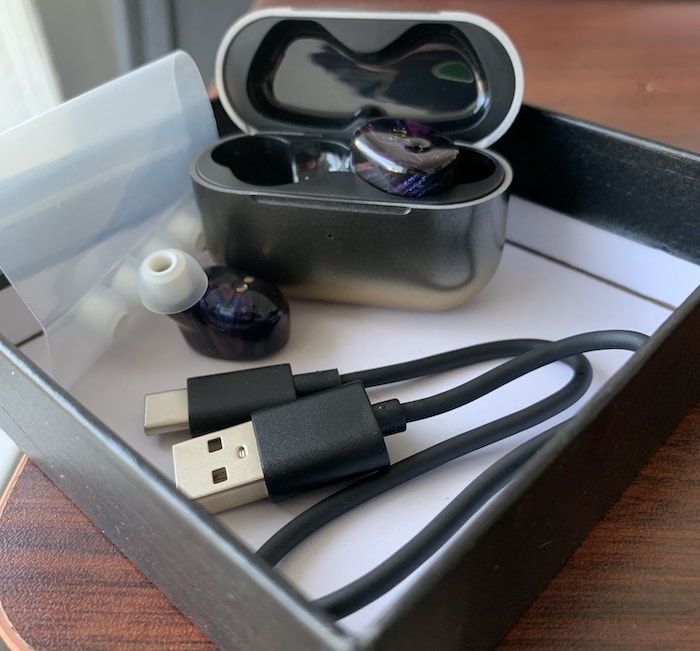 Unpacking the Peacock flight headphones.