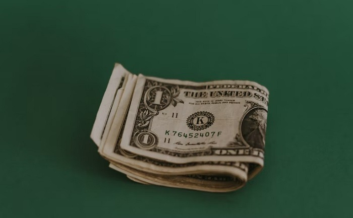 Folded stack of one dollar bills.