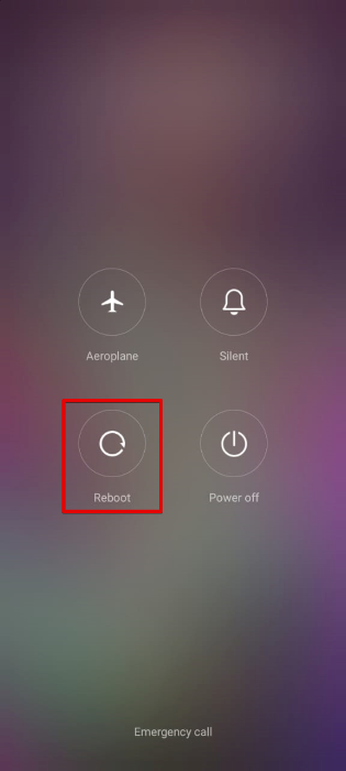 Tapping on Reboot button on Android device. 