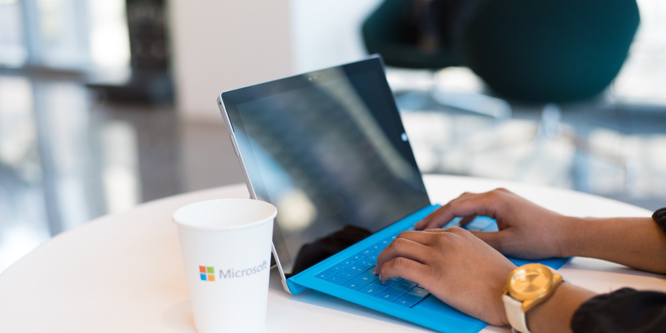 The Man Is Working On His Laptop