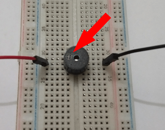 Piezo On Breadboard Arrow On Cross Red And Black Wire