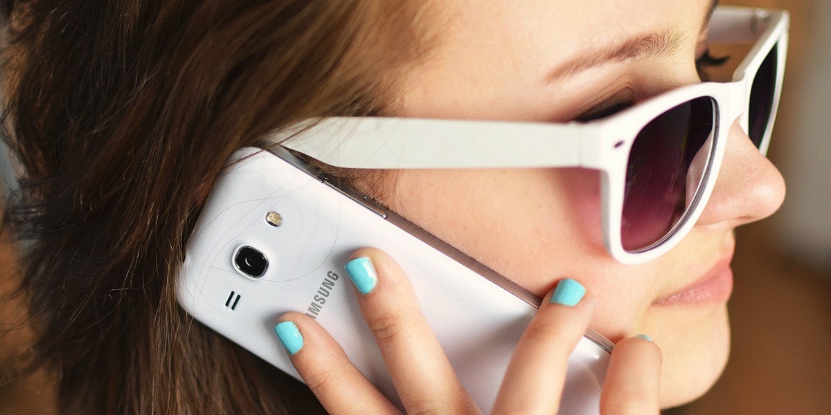 Women talking on a Samsung phone. 