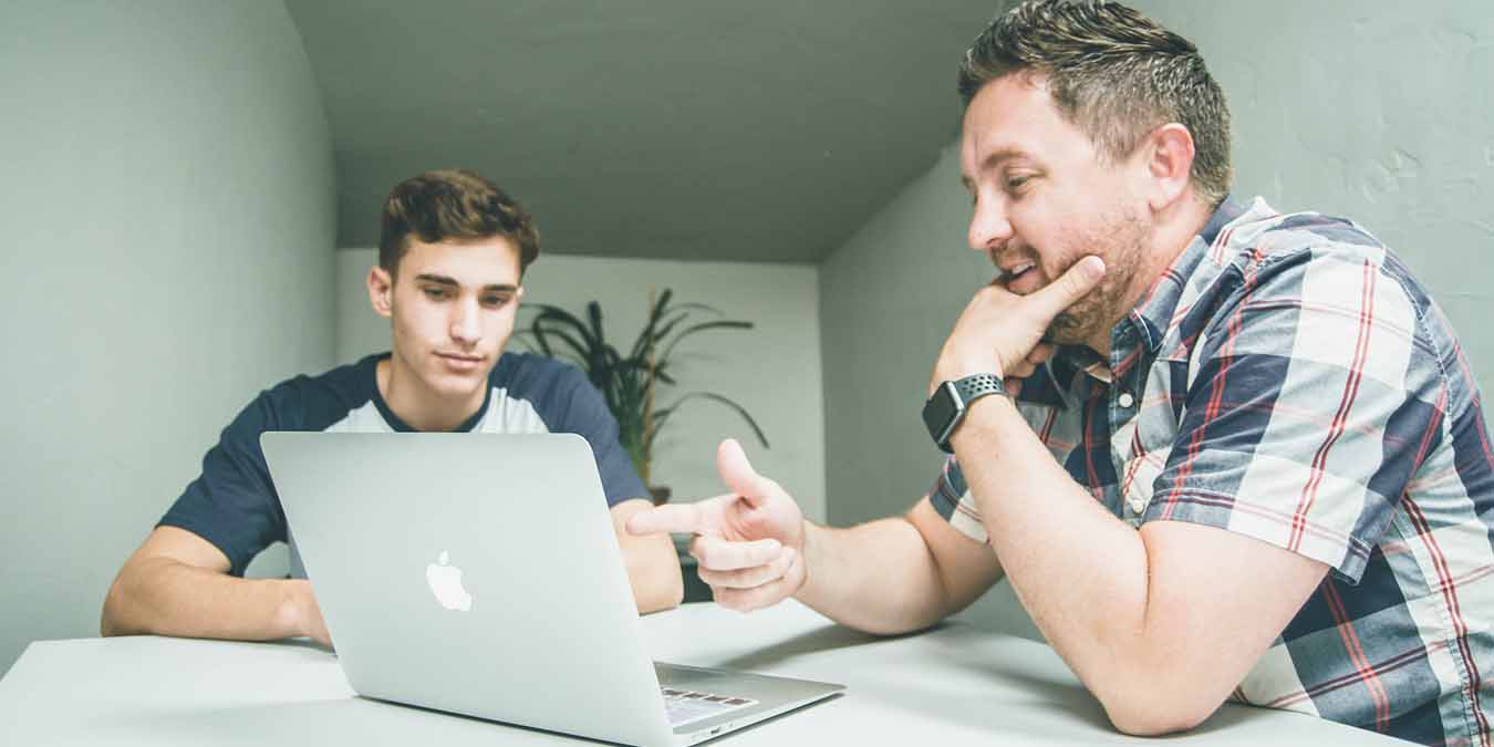 Man Using Voice Control On Mac