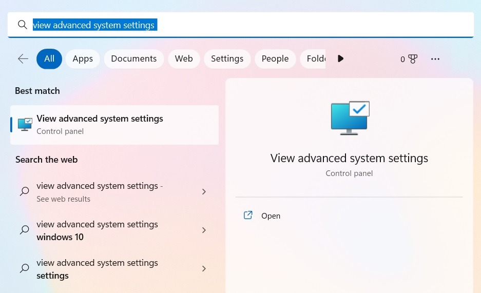 Typing "view advanced system settings" in Windows Search.
