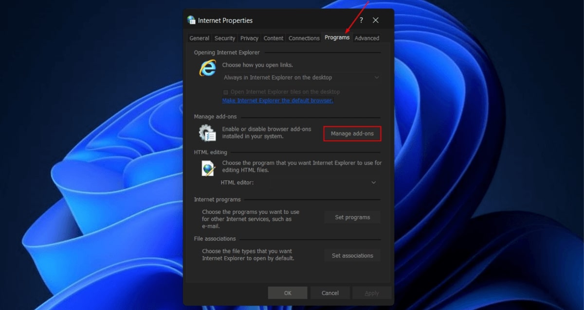 Switching to "Programs" tab in Internet Properties.