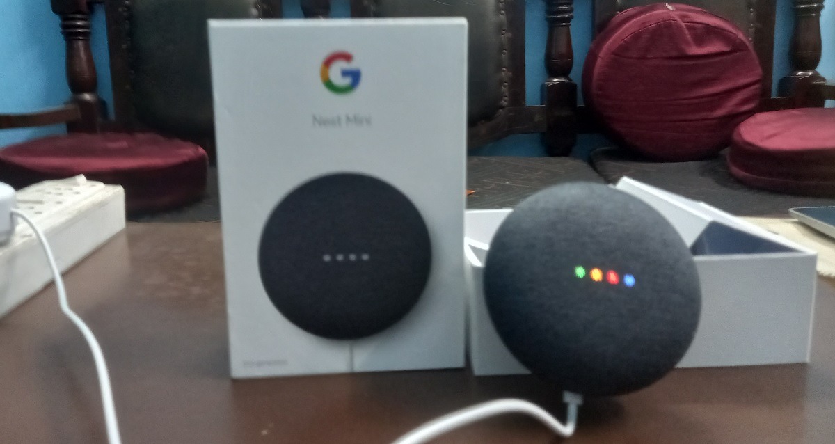 Nest Mini device plugged in to activate Google Assistant.