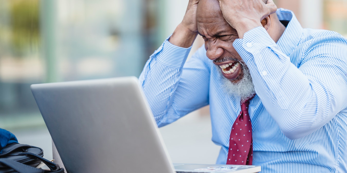 Angry Man In Front Of A Windows Pc