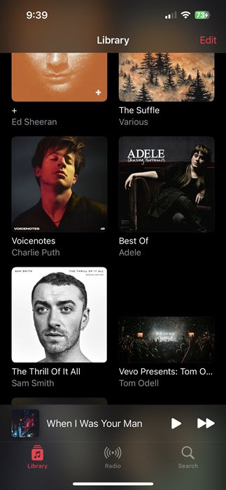 Music app view on iPhone with synced content.