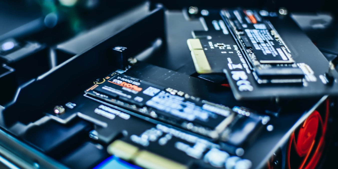 A photograph of two NVMe SSD cards.