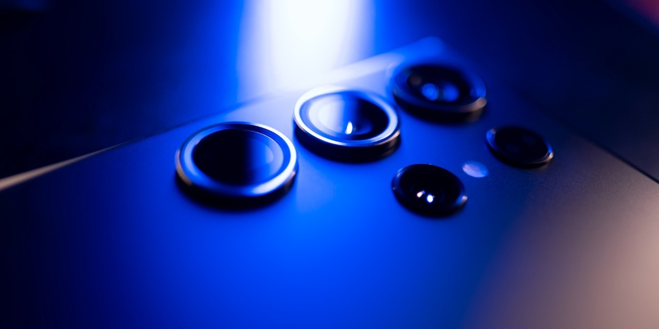 Close up of Samsung Galaxy S23 Ultra's cameras in blue light