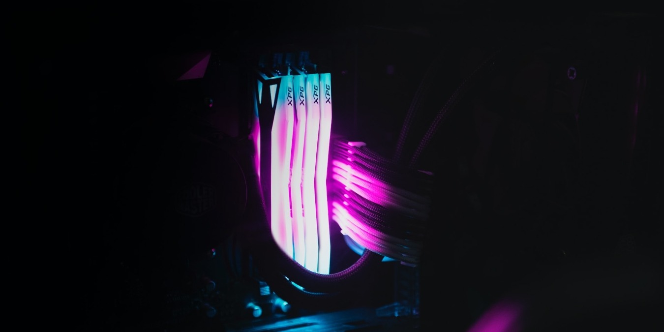 Close up of four RAM sticks with RGB lighting