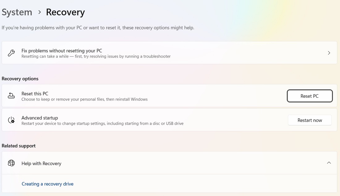 Click the Reset PC button in Recovery Options of Windows 11.