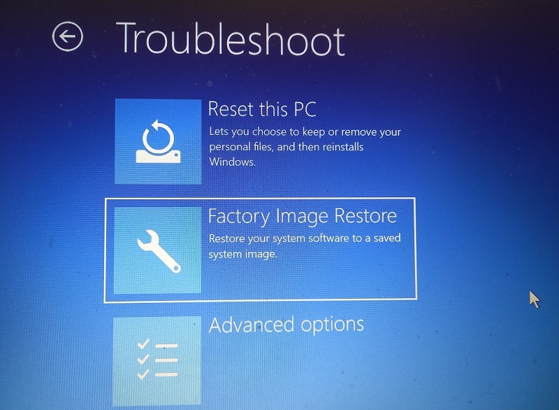 Select factory image restore in Troubleshoot mode of Advanced Startup in Windows 11.