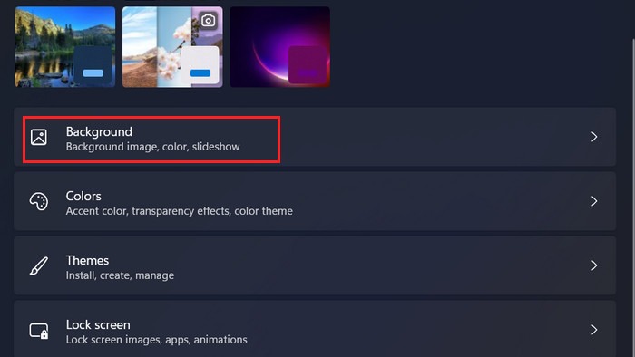 Clicking on the "Background" option in Settings in Windows 11.