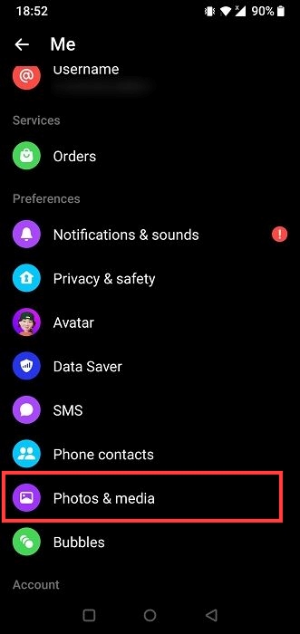 Clicking on "Photos & media" option in Messenger app. 
