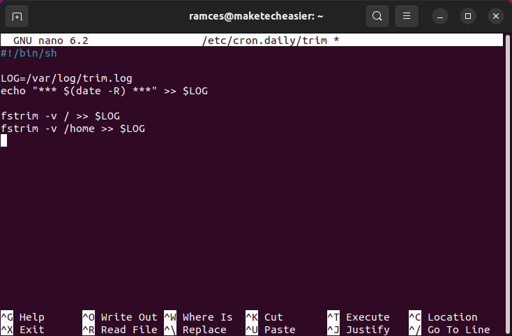 A terminal window showing a complete cron script for fstrim.