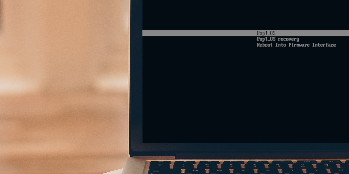 A photograph of a laptop showing a Systemd-boot bootloader.