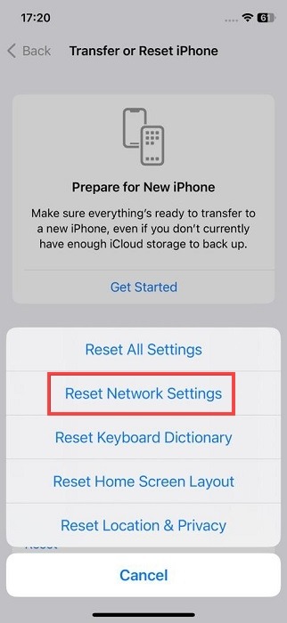 Selecting "Reset Network Settings" option on iOS. 