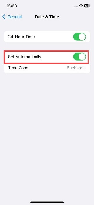 Enabling "Set Automatically" toggle on iOS. 