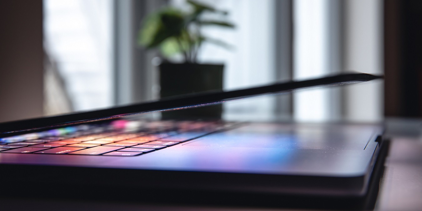Close Up Of Laptop Keyboard Colorful Neon Illumination, Backlit Keyboard.