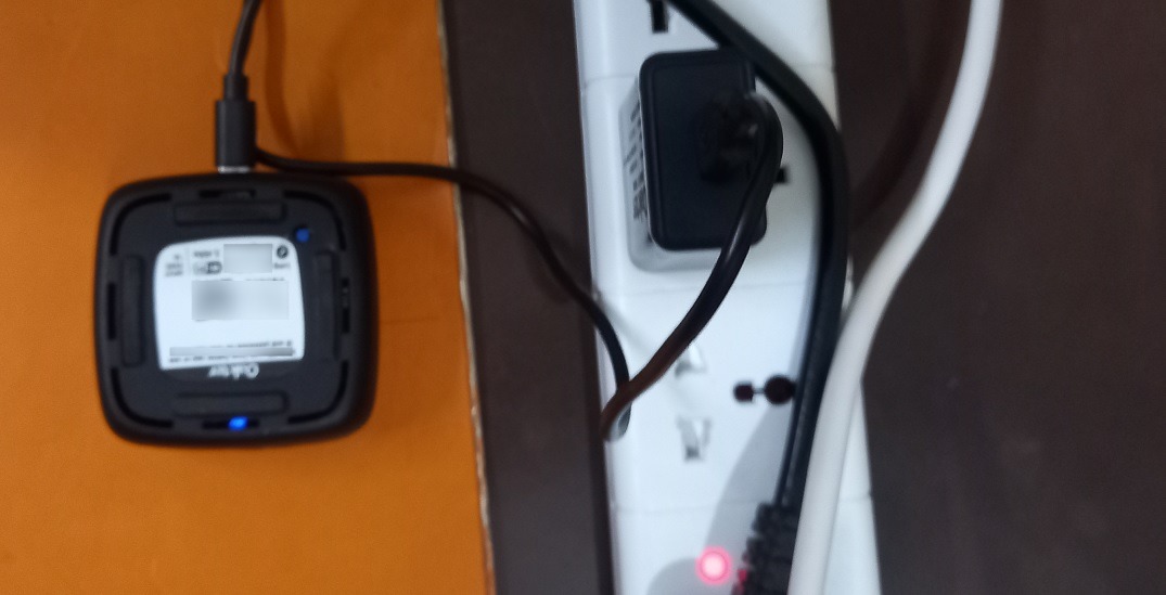 IR blaster device plugged in with lights blinking on.