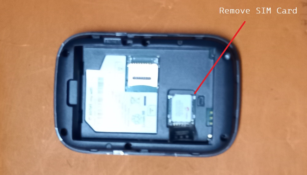 Removing SIM card from MiFi device by releasing the SIM Card cover.