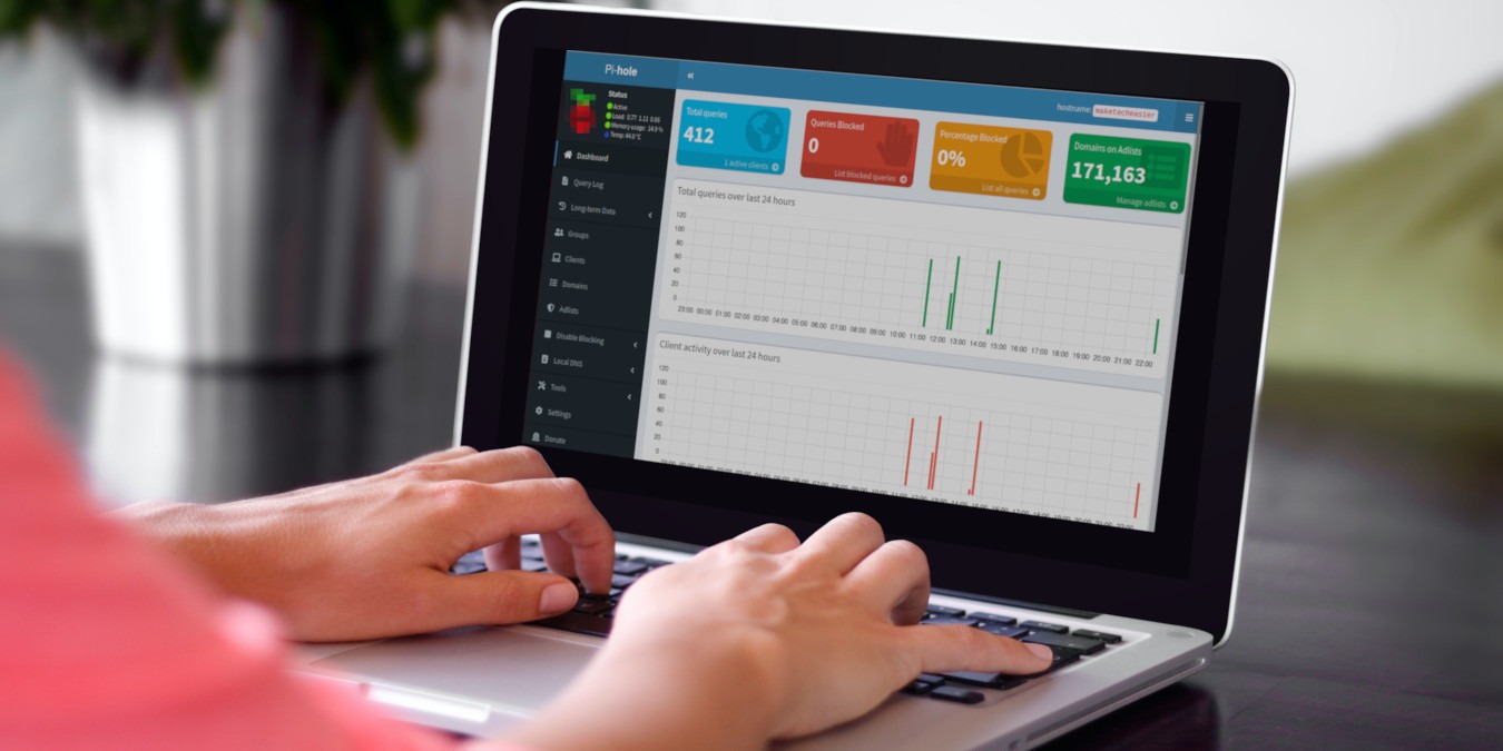 A photograph of a person using a laptop.