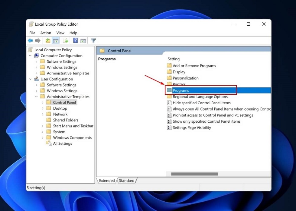 Accessing the "Programs" folder in Group Policy Editor.