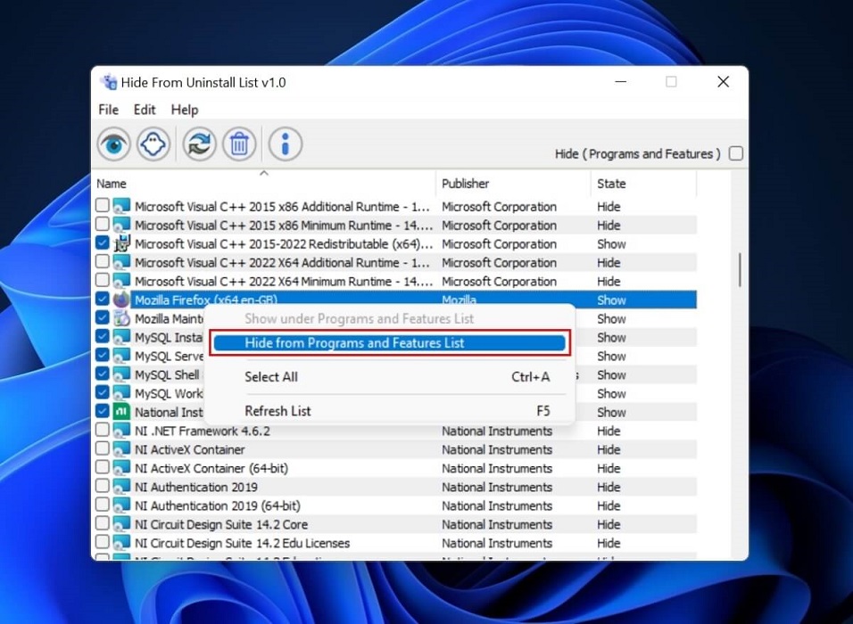 Clicking on "Hide from Programs and Features List" in Hide From Uninstall List app. 