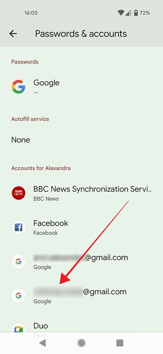 Selecting Google account to sign out of on Android phone.