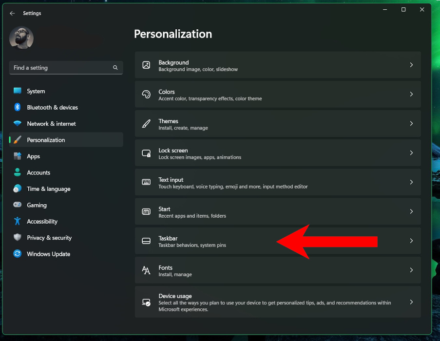 Selecting "Taskbar" option under "Personalization" menu.