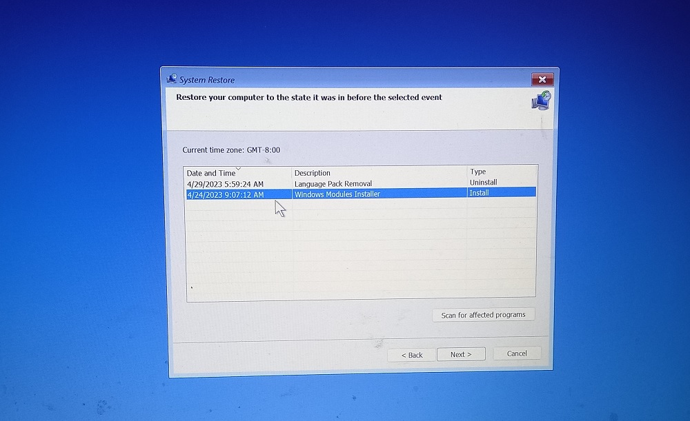 Choose restore point in System Restore under Advanced options. 