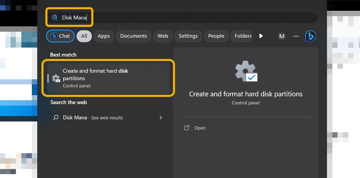 Typing "Disk Management" in Windows Search.