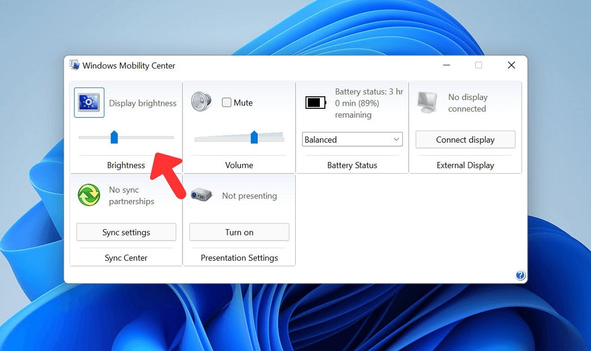 Adjusting brightness slider from Windows Mobility Center.