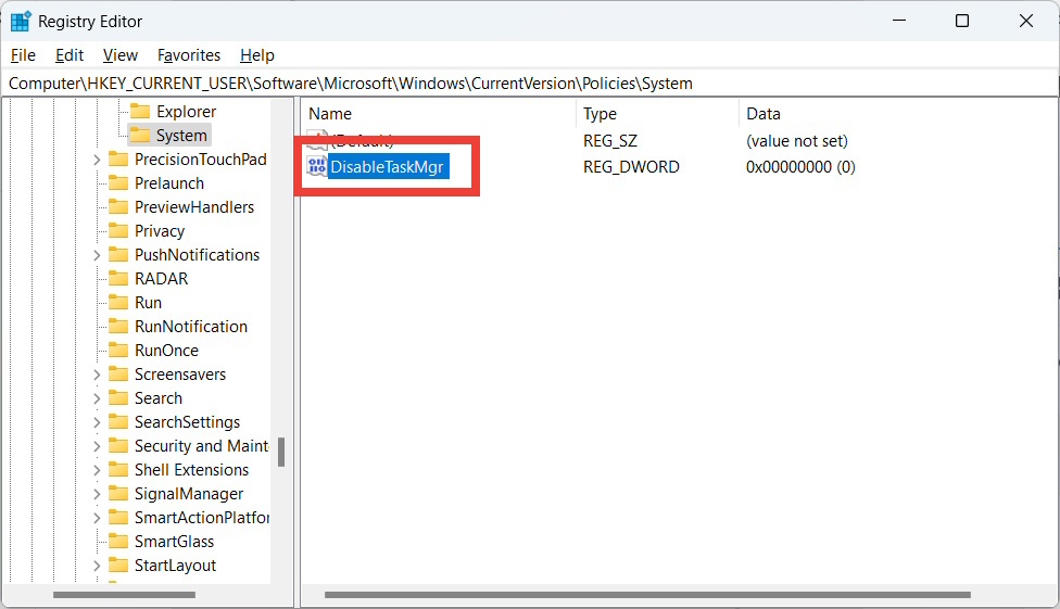 The "DisableTaskMgr" DWORD value highlighted in the Windows Registry Editor.