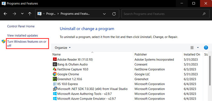 Selecting the "Turn Windows features on or off" option in Control Panel. 