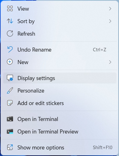 The "Diplay settings" option highlighted in the Windows context menu.