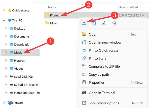 Finding the "iTunes" folder in File Explorer.