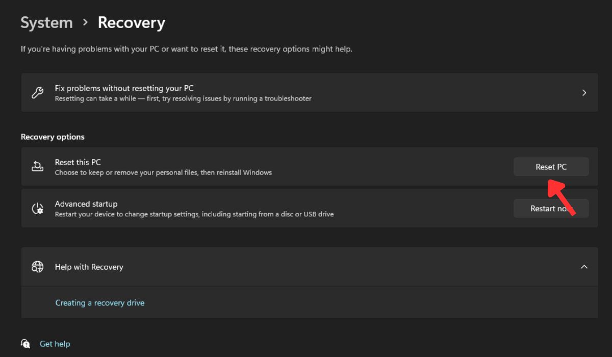 Clicking "Reset your PC" option under System Settings.