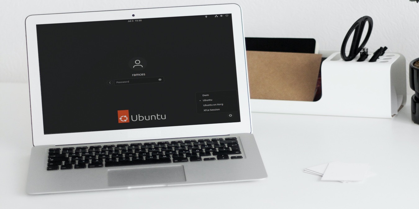 A photograph of a laptop in a white desktop.