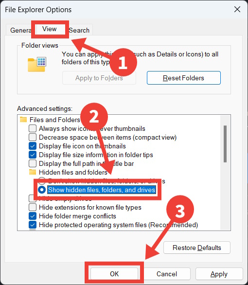 The process of revealing hidden folders in Folder Options on Windows.